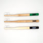 Image of all three options of Canary bamboo toothbrushes, with different color tips