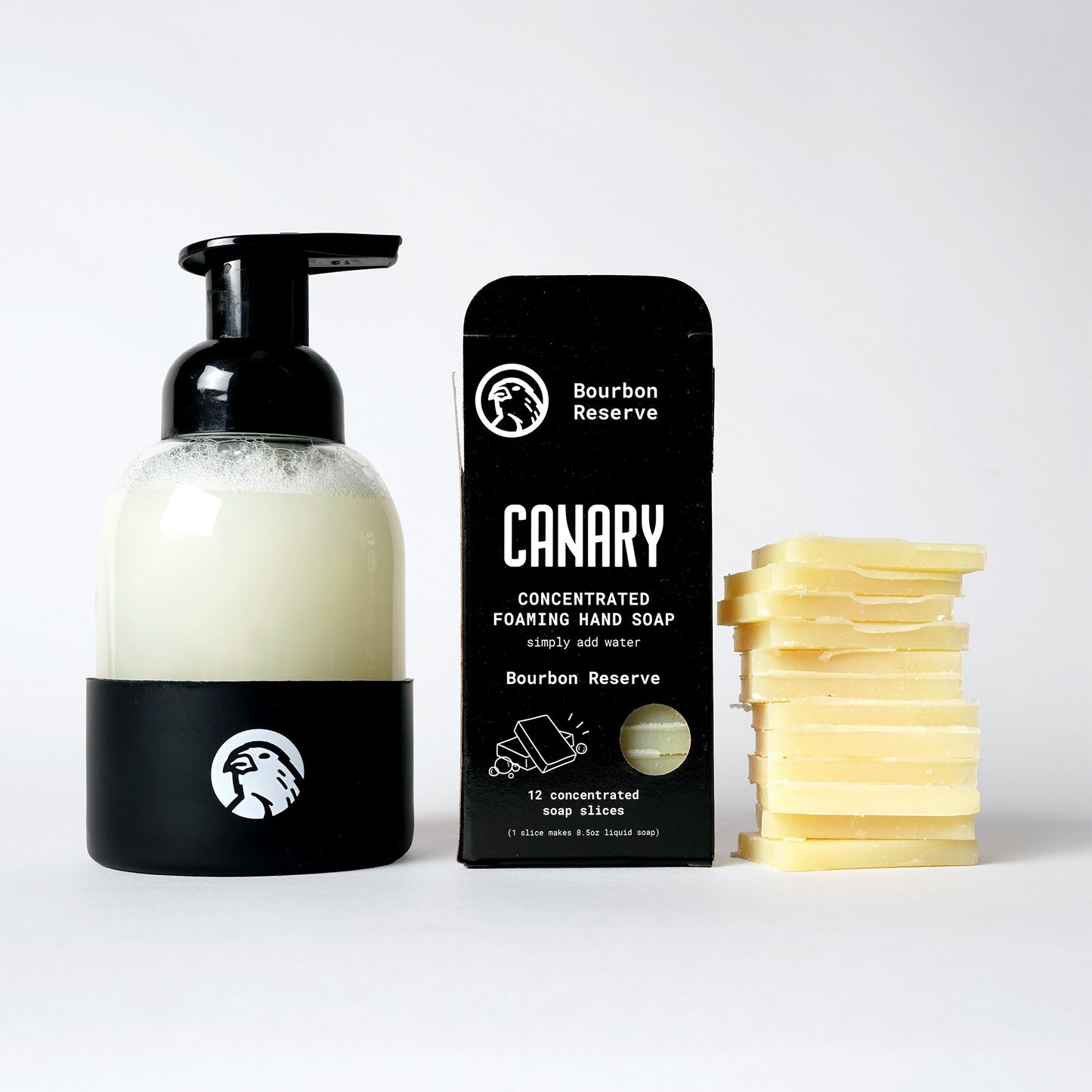 Image of Bourbon Reserve Foaming Hand Soap. 12 soap slices. Sustainable refillable glass bottle filled with soap and 12 soap slices next to product.